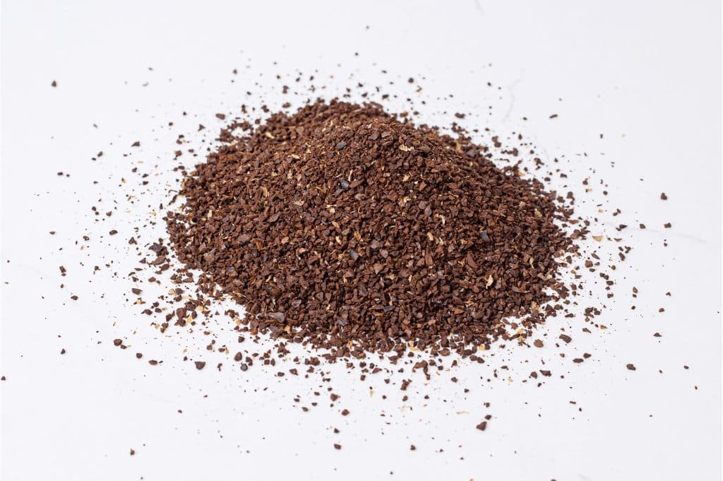 A close-up image of coffee grinds about the size of coarse sea salt.