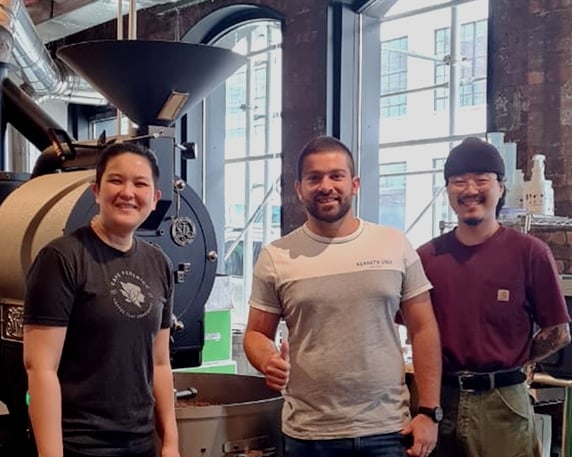 Chi Sum Ngai, Head Roaster, and John Pang, Production Manager, with José Giraldo at the Coffee Project roasting facility in Long Island City.